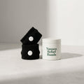 nausea bands next to a white tin