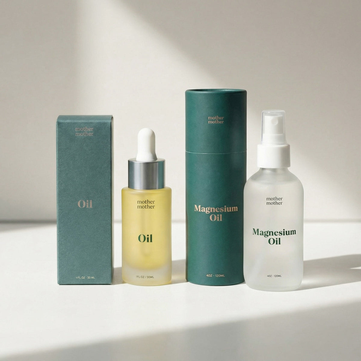 Collection of magnesium oil products from 'mother mother' on a light background