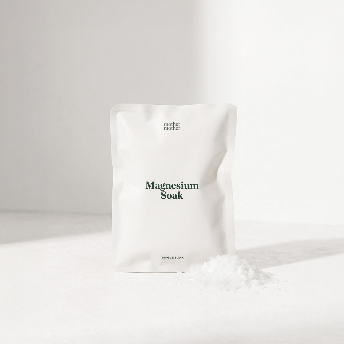 White bag labeled 'mother mother' with 'Magnesium Soak' on a white background