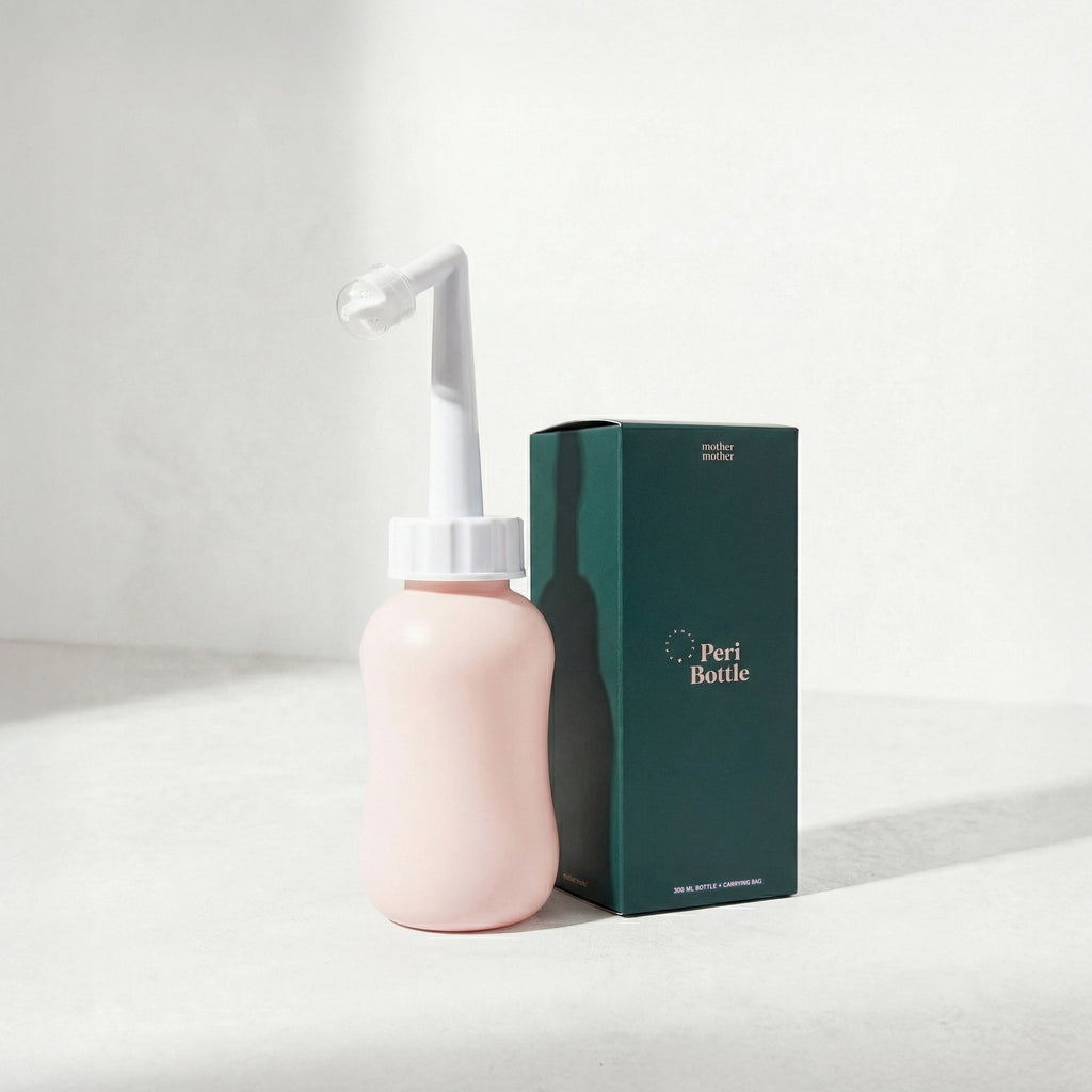 Pink peri bottle with white nozzle and green box labeled 'Peri Bottle' on a light gray background