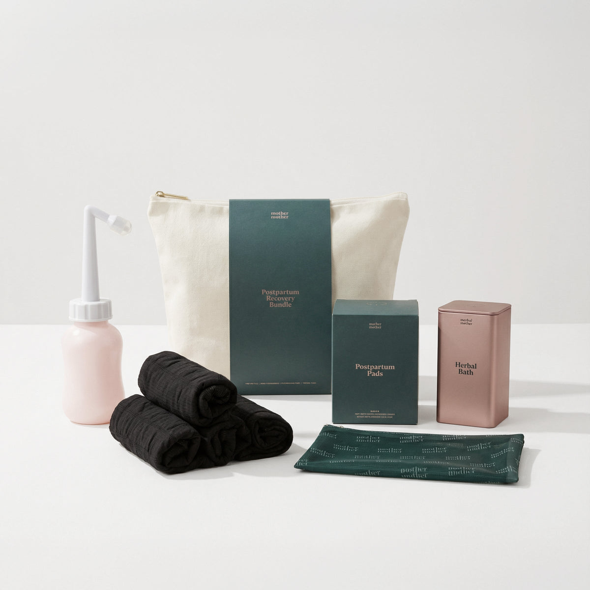 Mother Mother Postpartum Recovery Bundle arranged on a neutral background