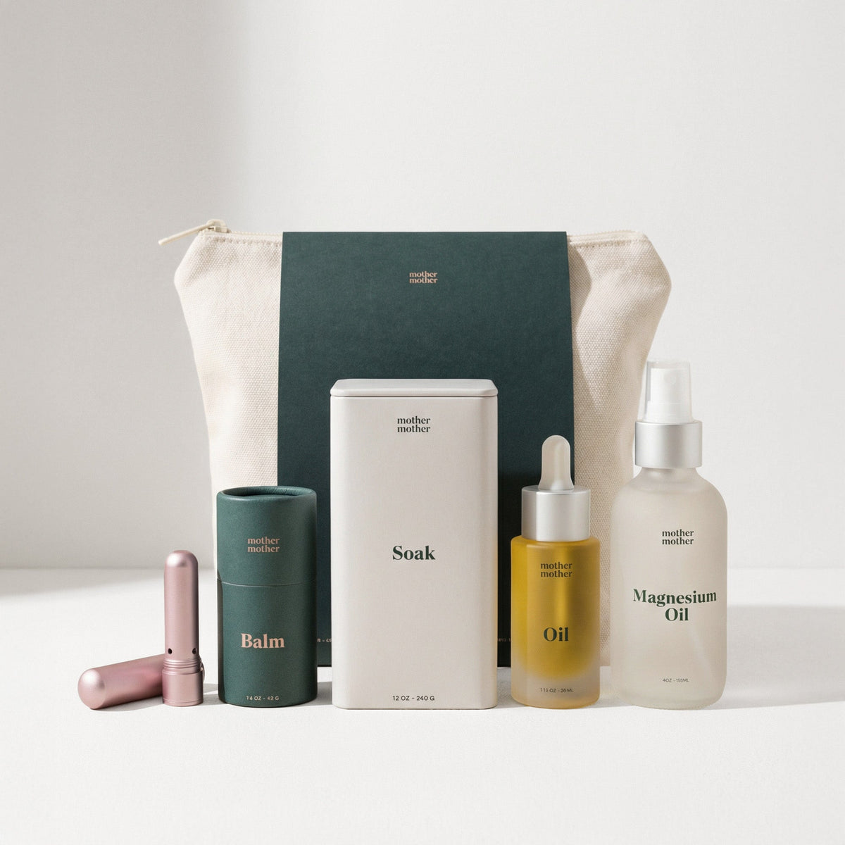 Collection of skincare products including bottles and a pouch on a light background